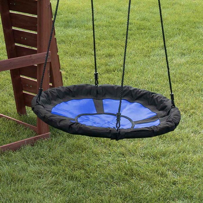 A circular swing with a blue and black design hangs from a structure above grassy ground, inviting playful movement and outdoor enjoyment.