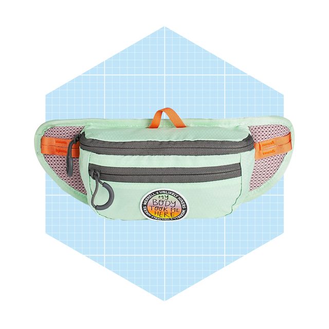 A mint green waist bag with zippers and a circular patch, positioned on a light blue grid background, is designed for carrying small items conveniently.