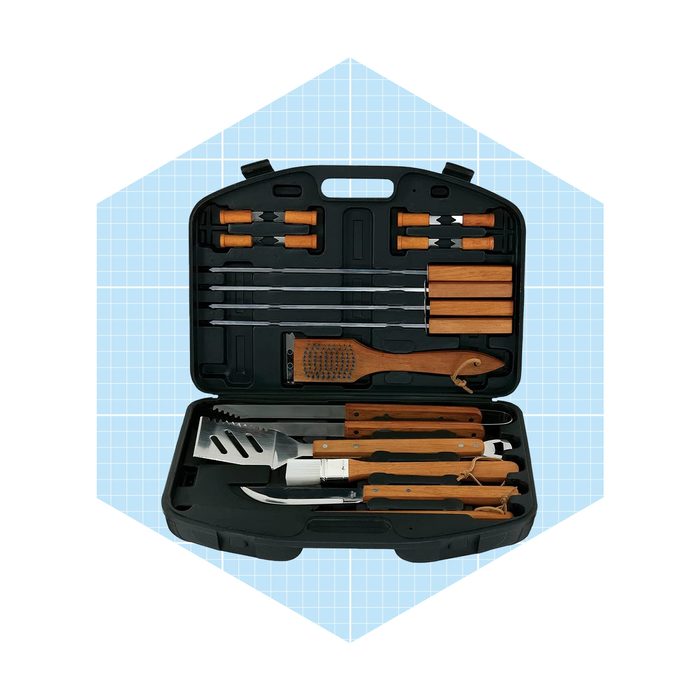 A barbecue toolset is arranged neatly in a black case, featuring various utensils like spatulas and skewers, set against a light blue grid background.