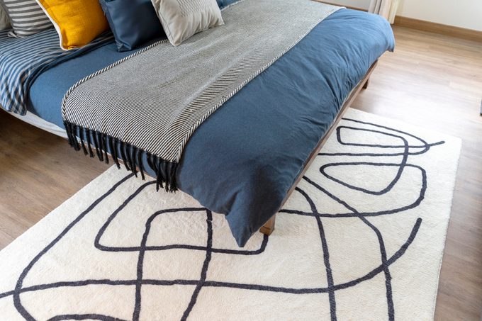 How Do You Get a Rug Under the Bed?
