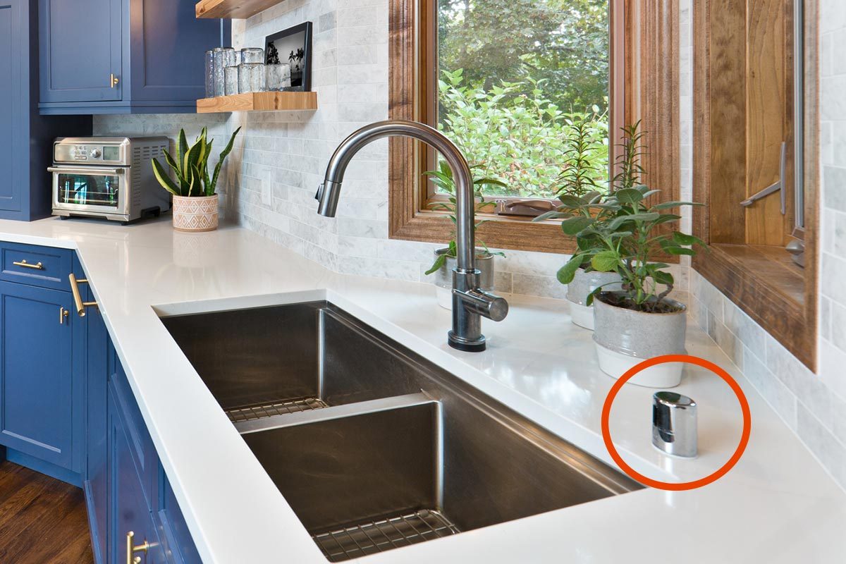 Kitchen sink with an air gap device circled in red